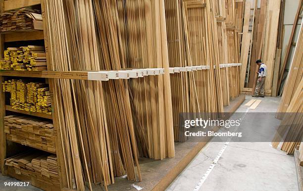 Customer looks over a selection of timber products at South Pacific Timbers in Auckland, New Zealand, on Tuesday, Dec. 22, 2009. New Zealand GDP...