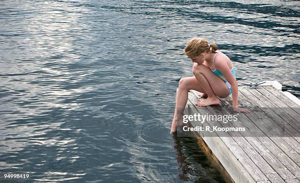 is it cold? testing the waters . . . - girl toes stock pictures, royalty-free photos & images