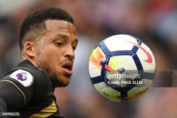 Swansea City's Swedish defender Martin Olsson controls the ball during the English Premier League football match between Manchester City and Swansea...