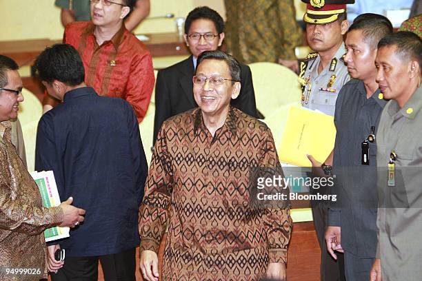 Boediono, Indonesia's vice president, center, attends a special committee of the House of Representatives in Jakarta, Indonesia, on Tuesday, Dec. 22,...