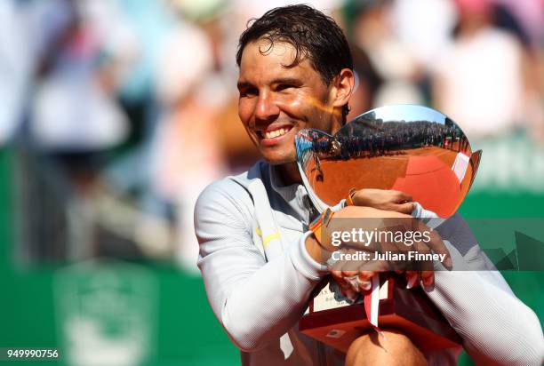 Rafael Nadal of Spain celebrates with the trophy after winning the Monte Carlo Rolex Masters against Kei Nishikori of Japan during day eight of ATP...