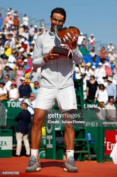 Rafael Nadal of Spain celebrates with the trophy after winning the Monte Carlo Rolex Masters against Kei Nishikori of Japan during day eight of ATP...