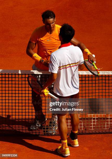Rafael Nadal of Spain is congratulated by Kei Nishikori of Japan after his win during day eight of ATP Masters Series: Monte Carlo Rolex Masters at...