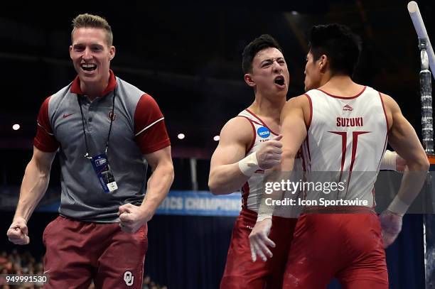 Oklahoma Sooners Peter Daggett and Oklahoma Sooners Genki Suzuki react after the parallel bars during the NCAA Men's Gymnastics National Championship...