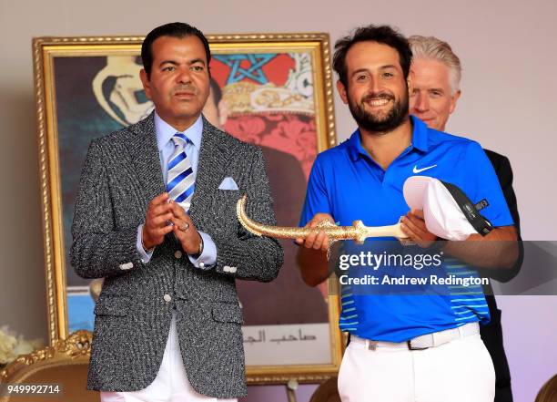 Alexander Levy of France is presented with the winners trophy by HRH Prince Moulay Rachid of Morocco after the final round of the Trophee Hassan II...