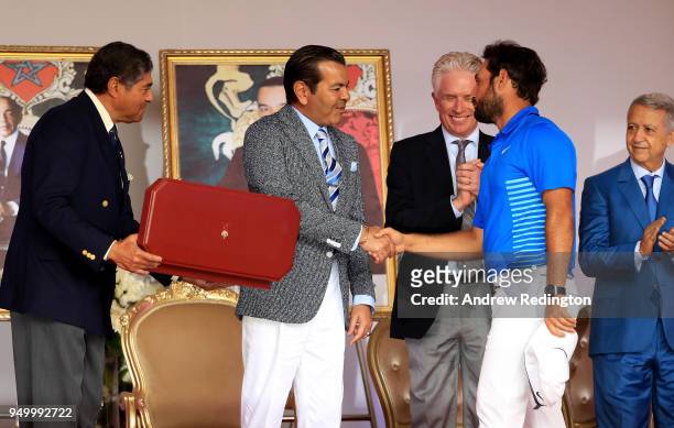 Alexander Levy of France is presented with the winners trophy by HRH Prince Moulay Rachid of Morocco after the final round of the Trophee Hassan II...