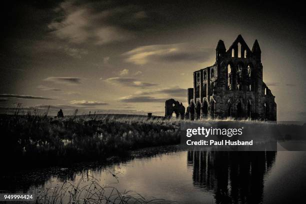 whitby abbey near sunset - whitby stock pictures, royalty-free photos & images