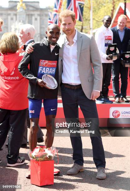 Prince Harry poses with Mo Farah, who came third in the Virgin Money London Marathon on April 22, 2018 in London, England.