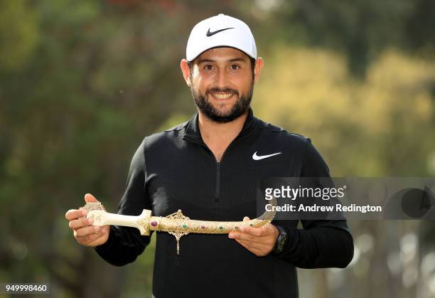 Alexander Levy of France celebrates with the winners trophy after the final round of the Trophee Hassan II at Royal Golf Dar Es Salam on April 22,...