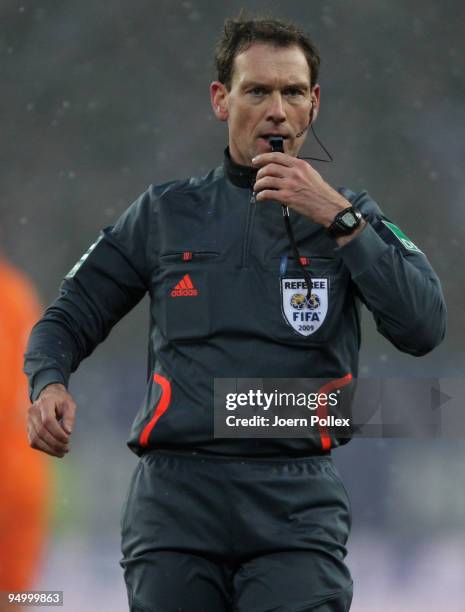 Referee Florian Meyer gestures ball during the Bundesliga match between Hamburger SV and Werder Bremen at HSH Nordbank Arena on December 20, 2009 in...