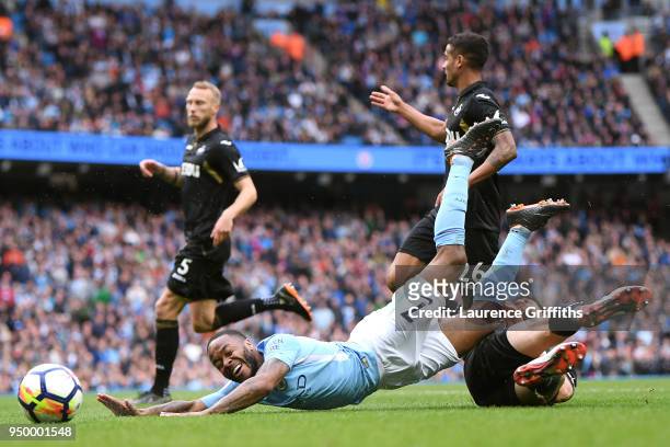 Federico Fernandez of Swansea City tackles Raheem Sterling of Manchester City leading to a penalty during the Premier League match between Manchester...