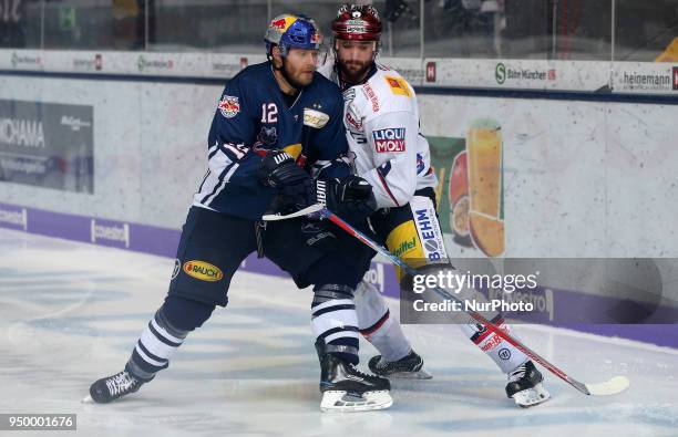 Danny Richmond of Eisbaeren Berlin vies Mads Christensen of Red Bull Munich during the DEL Playoff final match five between EHC Red Bull Munich and...