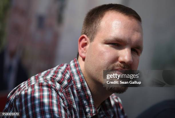 Sascha Krolzig of the far-right, fringe political party Die Rechte attends a press conference at the venue of a neo-Nazi music fest on April 21, 2018...