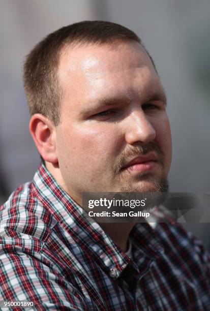 Sascha Krolzig of the far-right, fringe political party Die Rechte attends a press conference at the venue of a neo-Nazi music fest on April 21, 2018...