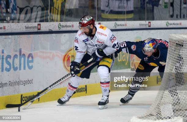 Jason Jaffray of Red Bull Munich vies Thomas Oppenheimer of Eisbaeren Berlin during the DEL Playoff final match five between EHC Red Bull Munich and...