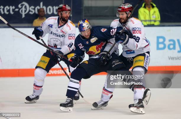 James Sheppard of Eisbaeren Berlin vies Patrick Hager of Red Bull Munich during the DEL Playoff final match five between EHC Red Bull Munich and...