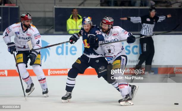 James Sheppard of Eisbaeren Berlin vies Patrick Hager of Red Bull Munich bduring the DEL Playoff final match five between EHC Red Bull Munich and...