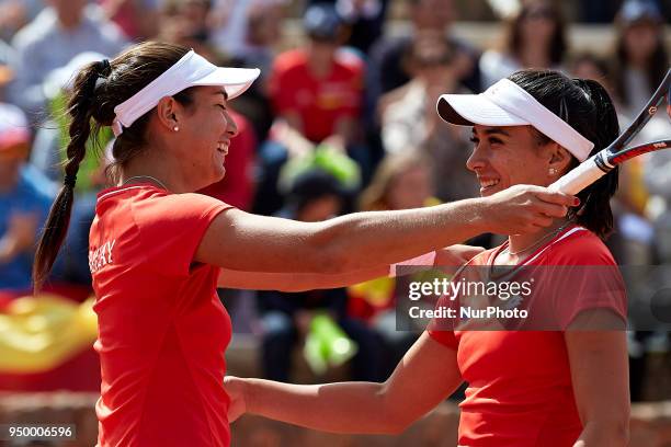 Veronica Cepede of Paraguay celebrates the victory with her teammate Montserrat Gonzalez in their doubles match against Georgina Garca Perez and...