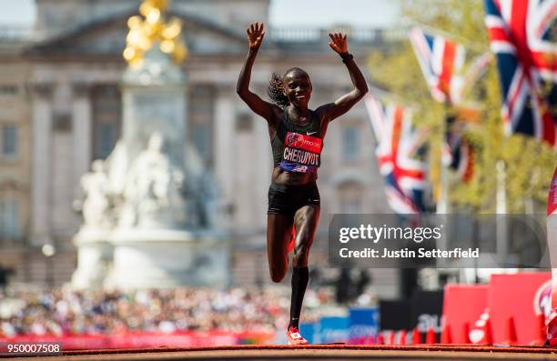 Vivian Cheruiyot of Kenya celebrates after crossing the finish line to win the elite women's race during the Virgin Money London Marathon at United...