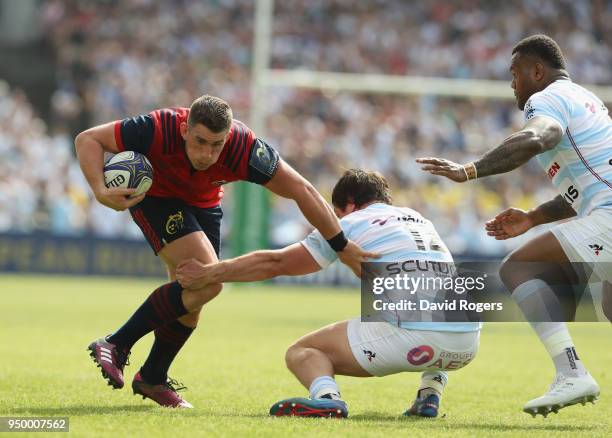 Ian Keatley of Munster is tackled by Henry Chavancy during the European Rugby Champions Cup Semi-Final match between Racing 92 and Munster Rugby at...