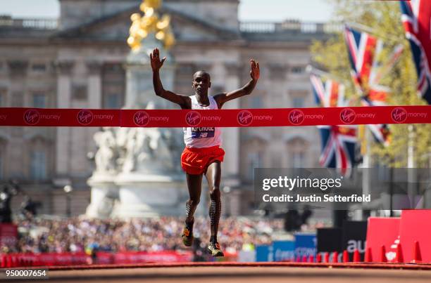 Eliud Kipchoge of Kenya crosses the finish line to win the elite men's race during the Virgin Money London Marathon at United Kingdom on April 22,...