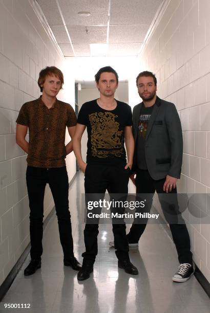 Dominic Howard, Matt Bellamy and Chris Wolstenholme of Muse pose for a group portrait backstage at the Rod Laver Arena on November 15th 2007 in...