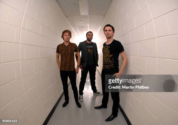 Dominic Howard, Chris Wolstenholme and Matt Bellamy of Muse pose for a group portrait backstage at the Rod Laver Arena on November 15th 2007 in...