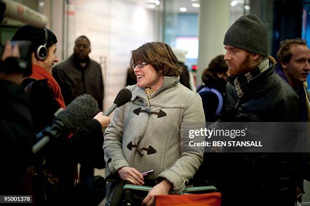 Eurostar passengers speak to the media at Kings Cross St Pancras train station in London, after arriving from Brussels, on December 22, 2009. Packed...