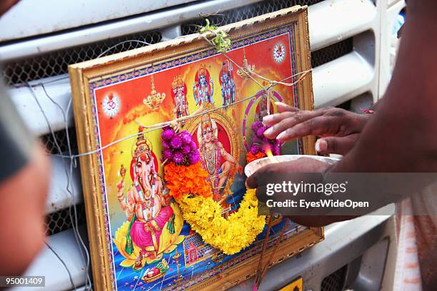 Indian hindu gods fixed at the front of a pilgrims car on December 12, 2009 in Trivandrum, India.