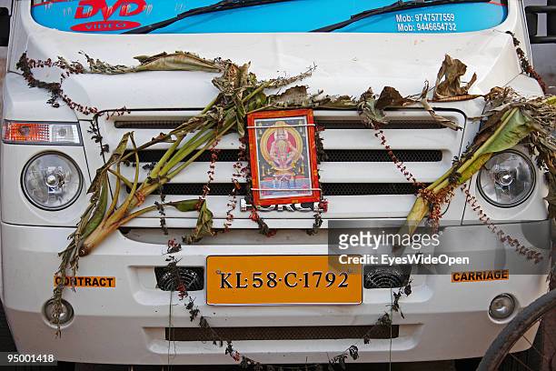 Indian hindu gods fixed at the front of a pilgrims car on December 12, 2009 in Trivandrum, India.