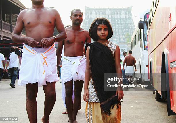Indian young girl walking at the famous temple Sri Padmanabhaswamy on December 12, 2009 in Trivandrum, South India. The temple is the spiritual heart...