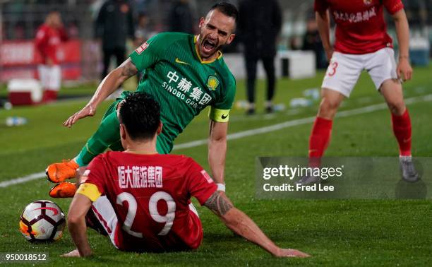 Renato Augusto of Beijing Guoan FC and Gao Lin of Guangzhou Evergrande Taobao fight for the ball during during 2018 China Super League match between...