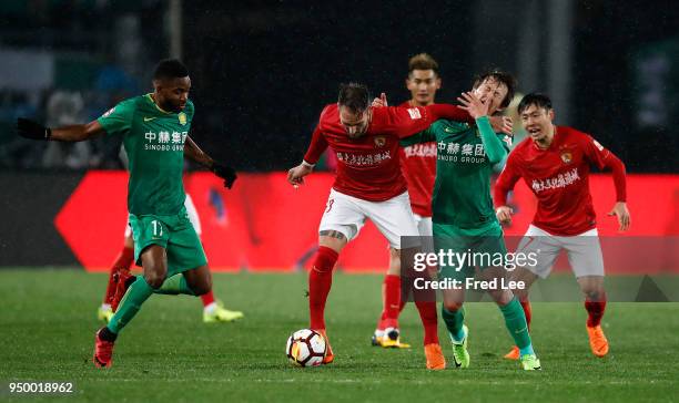 Cedric Bakambu , Piao Cheng of Beijing Guoan and Nemanja Gudelj of Guangzhou Evergrande Taobao in action during 2018 China Super League match between...