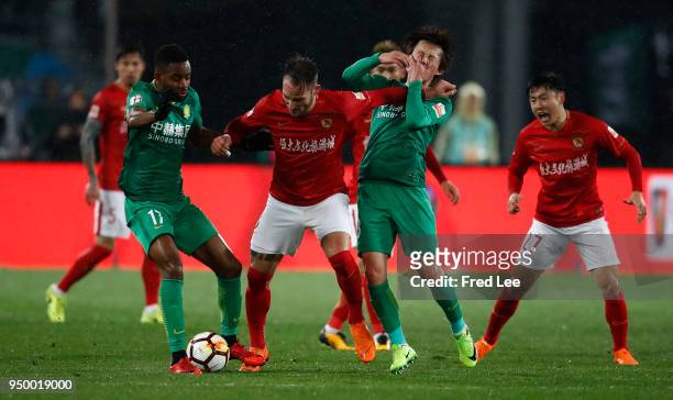 Cedric Bakambu , Piao Cheng of Beijing Guoan and Nemanja Gudelj of Guangzhou Evergrande Taobao in action during 2018 China Super League match between...