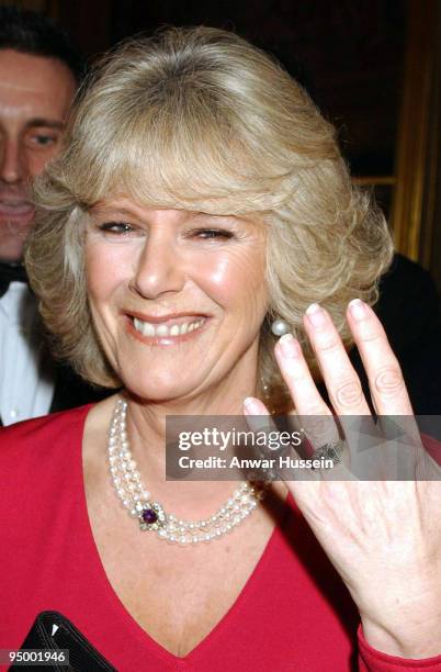 Camilla Parker Bowles shows her engagement ring when she arrives for a party at Windsor Castle after announcing their engagement earlier 10 February,...