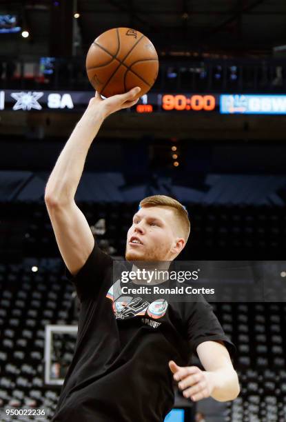 Davis Bertans of the San Antonio Spurs takes practice shots before the start of game four against the Golden State Warriors at AT&T Center on April...