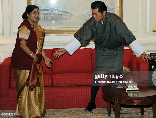 King of Bhutan, Jigme Khesar Namgyel Wangchuck welcomes India's new opposition leader Sushma Swaraj to a meeting in New Delhi on December 22, 2009....