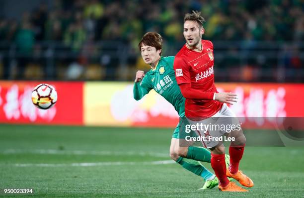 Piao Cheng of Beijing Guoan and Nemanja Gudelj of Guangzhou Evergrande Taobao in action during 2018 China Super League match between Beijing Guoan...