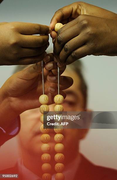 Children from the San Ildefonso school take part in the draw of the winning numbers of Spain's Christmas lottery named "El Gordo" in Madrid on...