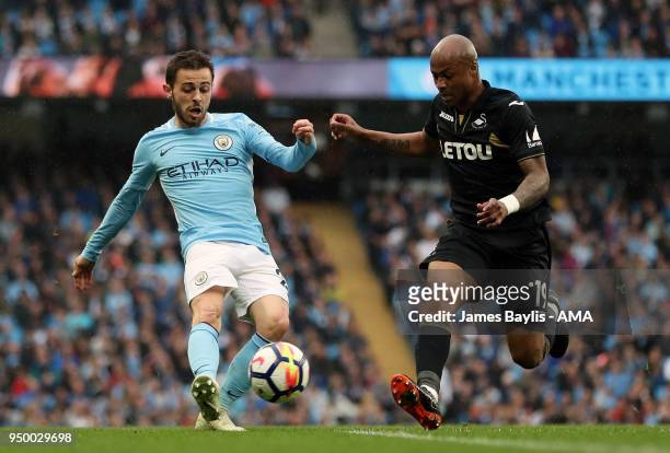 Bernardo Silva of Manchester City and Andre Ayew of Swansea City during the Premier League match between Manchester City and Swansea City at Etihad...