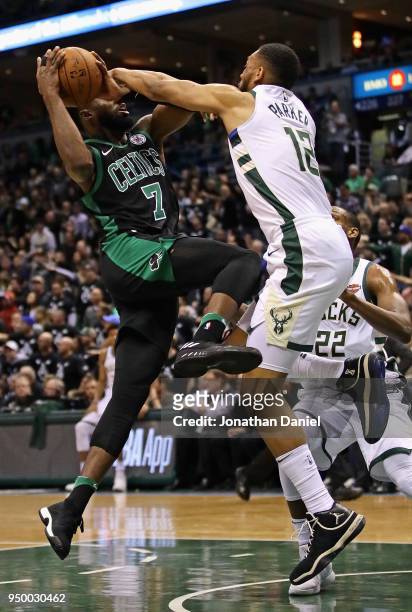 Jabari Parker of the Milwaukee Bucks fouls Jaylen Brown of the Boston Celtics during Game Four of Round One of the 2018 NBA Playoffs at the Bradley...