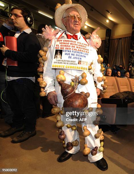 Man wearing in costume takes part in the draw of the winning numbers of Spain's Christmas lottery named "El Gordo" in Madrid on December 22, 2009....