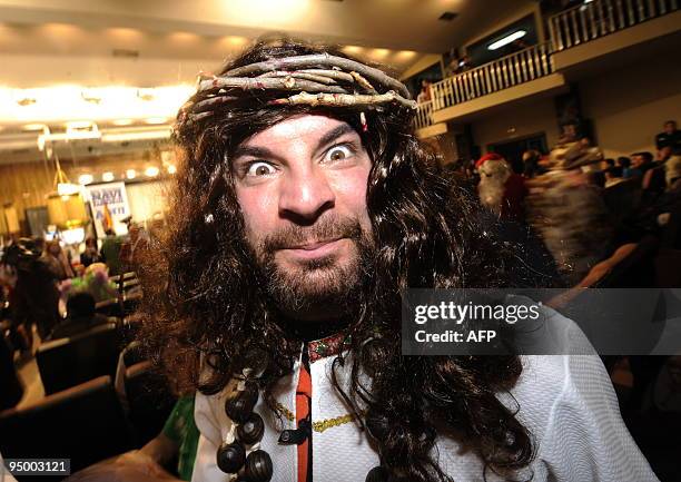 Man wearing a costume takes part in the draw of the winning numbers of Spain's Christmas lottery named "El Gordo" in Madrid on December 22, 2009....