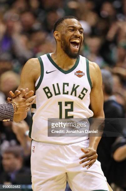 Jabari Parker of the Milwaukee Bucks celebrates after hitting a shot against the Boston Celtics during Game Four of Round One of the 2018 NBA...