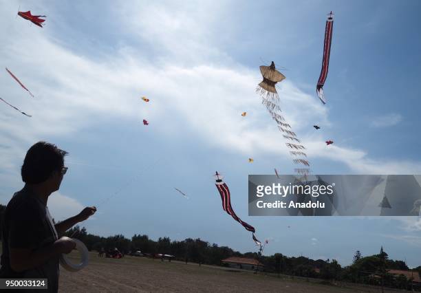 Ikadek Dwi Armika flies an organic kite that made up of taep leaves, corn husk and dried fruits on the beach of Sanur in Bali, Indonesia on April 21,...