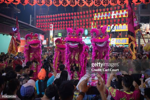 Lion dancers perform at Jenn Lann Temple during festivities marking the end of the nine day Mazu pilgrimage, on April 22, 2018 in Dajia near...