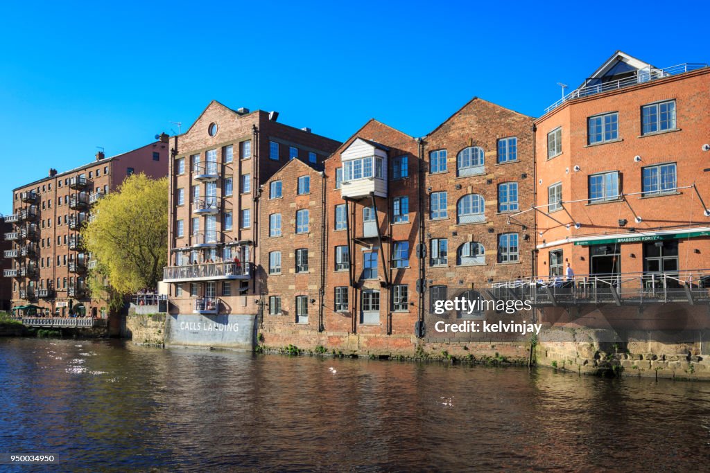 Apartments, bars and restaurants on the river Aire in Leeds, Yorkshire.