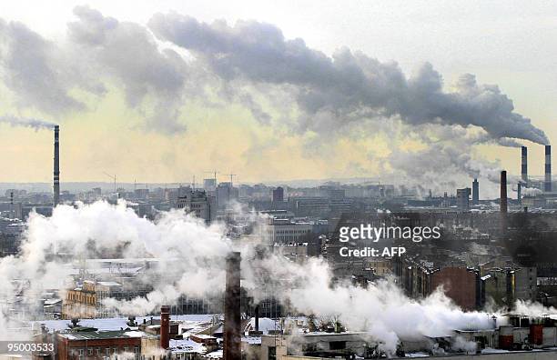 Smoke from the chimneys billow over St. Petersburg, 03 March 2005. Russia's greenhouse gas emissions fell by up to 38 percent between 1990 and 1999...