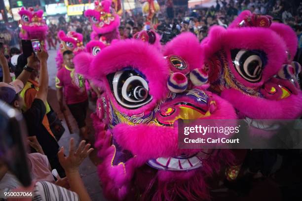 Lion dancers perform at Jenn Lann Temple during festivities marking the end of the nine day Mazu pilgrimage, on April 22, 2018 in Dajia near...