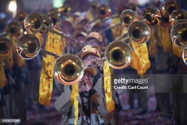 Trumpeters play at Jenn Lann Temple during festivities marking the end of the nine day Mazu pilgrimage, on April 22, 2018 in Dajia near Taichung,...